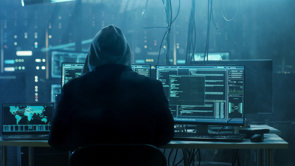 Computer Hacker sitting at his desk